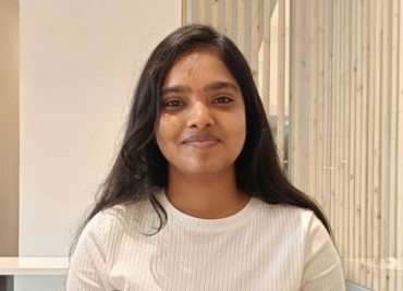 Bharathi smiling in front of camera